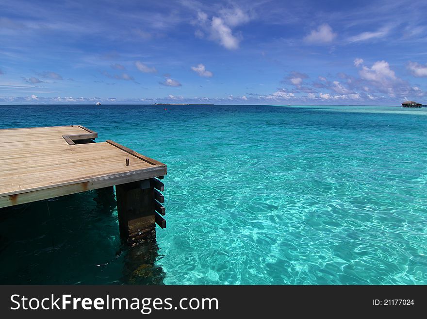 Deck And Pier Of Blue Tropical Sea, Maldives