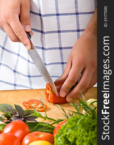 Man cutting vegetables at kitchen