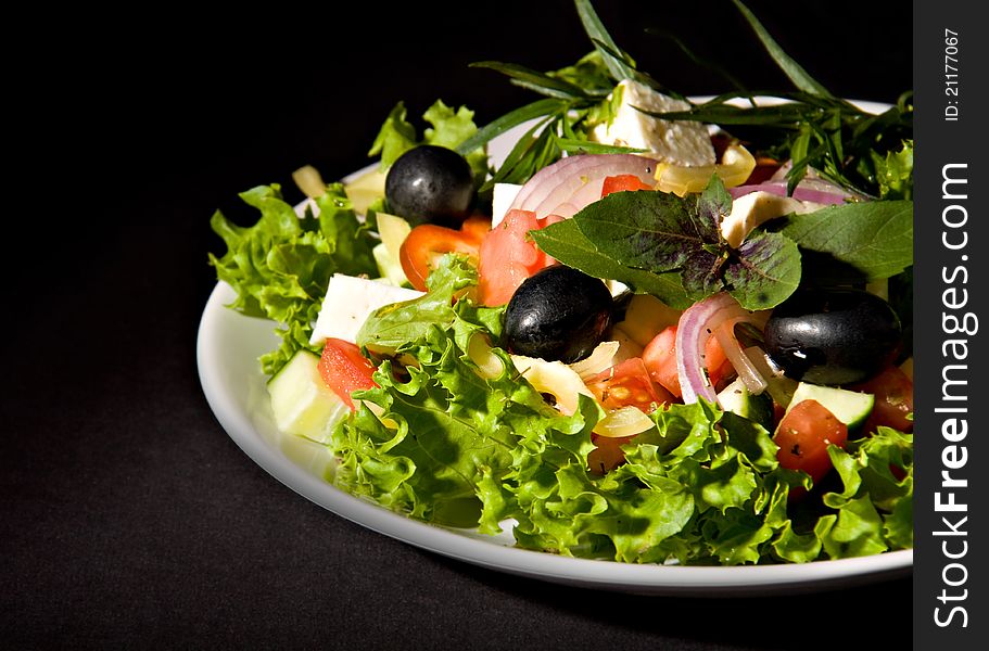 Closeup of Greek Salad on black background. Closeup of Greek Salad on black background