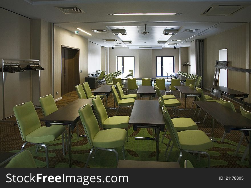 Room with many green chairs. Room with many green chairs