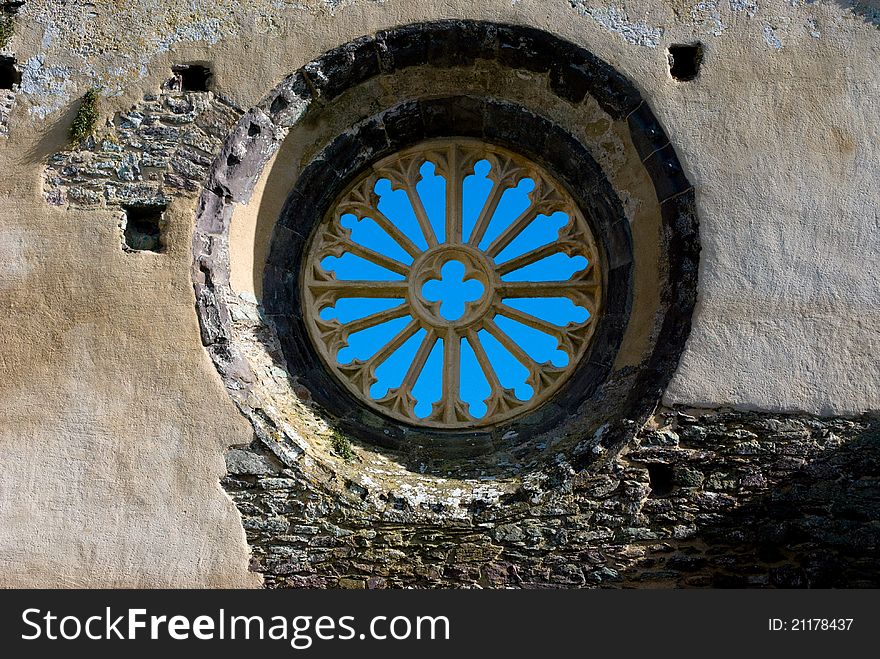 Blue sky through old window in ruined building