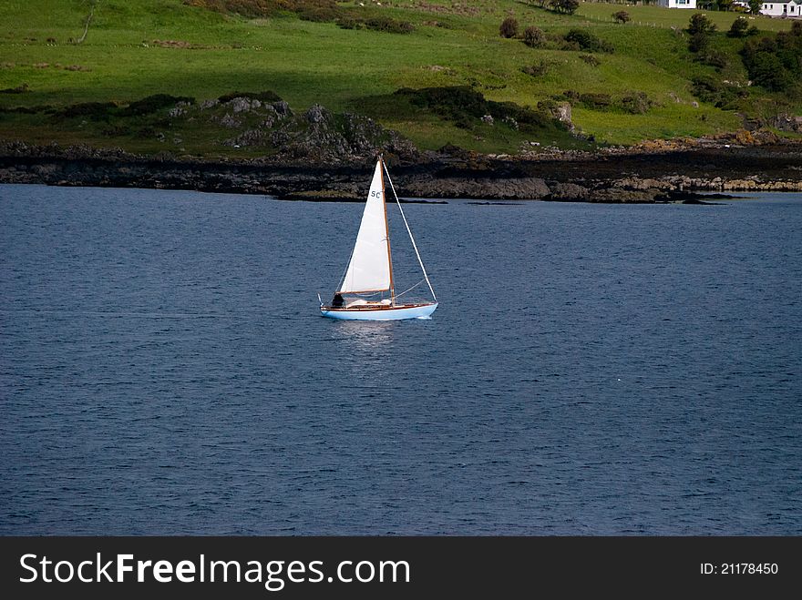 Sailing boat off the coast of Scotland