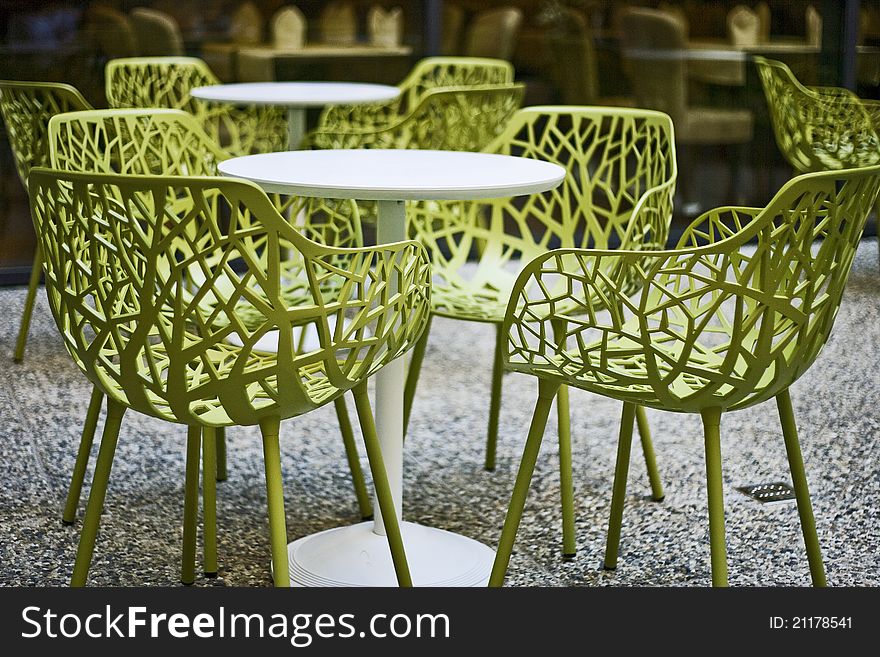 Terase with tables and green chairs. Terase with tables and green chairs