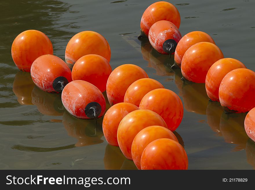 Orange bouys on a lake