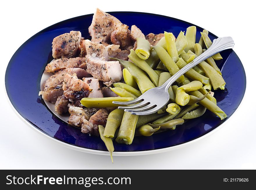 Studio shot of meal steak with green beans on white background