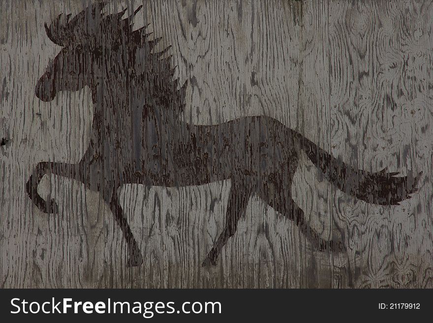 Wooden texture with an Icelandic horse pattern. Wooden texture with an Icelandic horse pattern