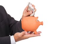 Man Holding A Piggy Bank And Dollars Stock Image