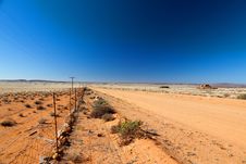 Road Through A Vast, Arid Landscape Royalty Free Stock Photography Road Through A Vast, Arid Landscape Royalty Free Stock Photography