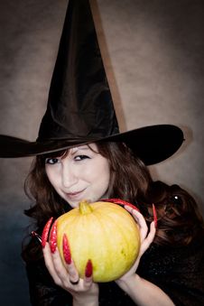 Witch With Pumpkin In Hands Stock Photo Witch With Pumpkin In Hands Stock Photo