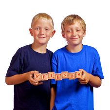 Young Friends Holding Letter Blocks Stock Photography Young Friends Holding Letter Blocks Stock Photography