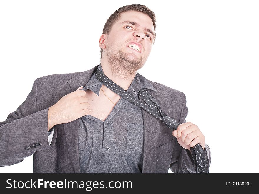 Young businessman pulling his tie and getting stressed. Young businessman pulling his tie and getting stressed