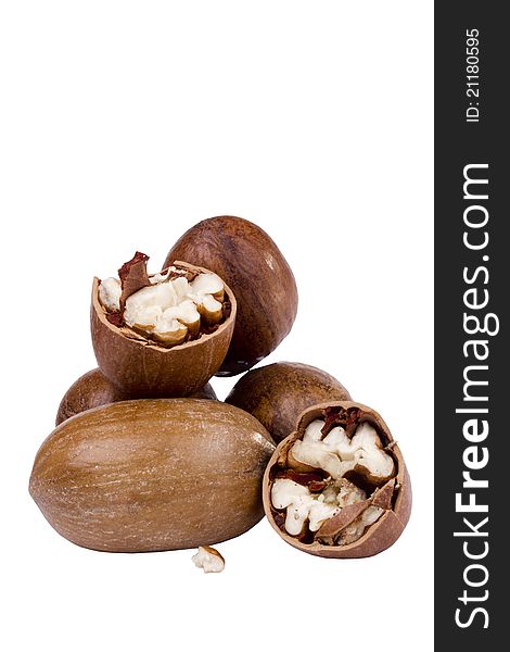 Pile of pecan nuts isolated on a white background.