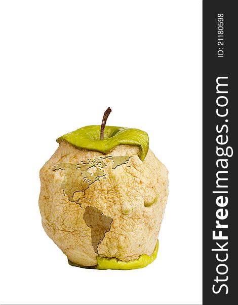 Decaying green Granny Smith apple with a silhouette of an earth isolated on a white background. Decaying green Granny Smith apple with a silhouette of an earth isolated on a white background.