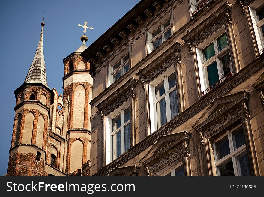Architectural details of an old house and medieval church on Saint Mary in Torun, Poland. Architectural details of an old house and medieval church on Saint Mary in Torun, Poland