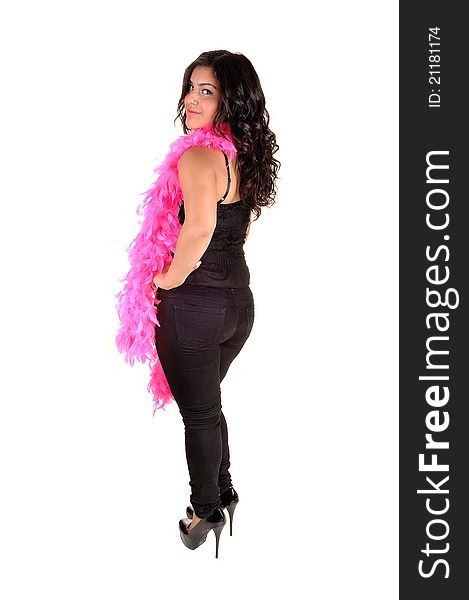 A pretty girl, standing from the back, looking over her shoulder, with pink feather around her neck, in black jeans and heels, for white background. A pretty girl, standing from the back, looking over her shoulder, with pink feather around her neck, in black jeans and heels, for white background.