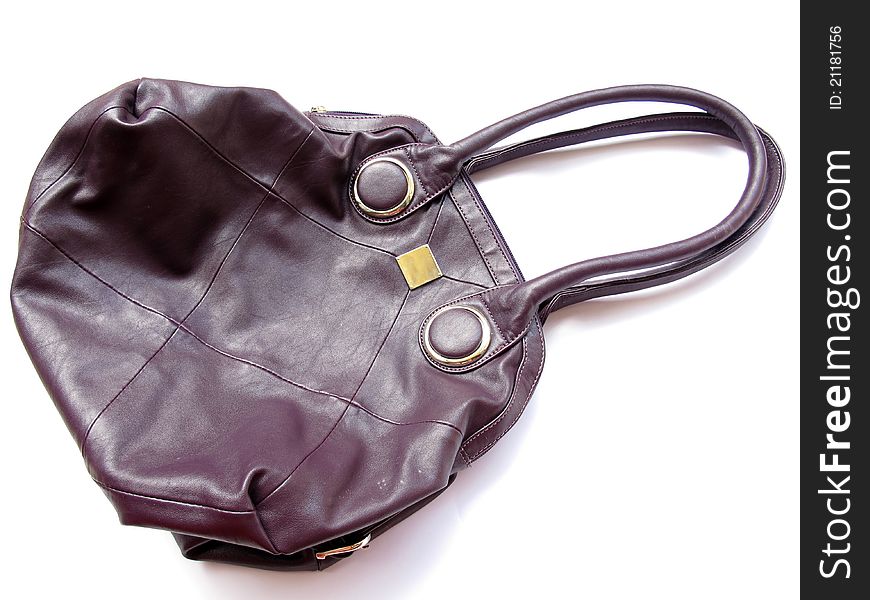 A simple and elegant branded leather handbag on white background. A simple and elegant branded leather handbag on white background.