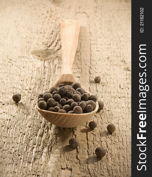 Pepper spice on wooden spoon