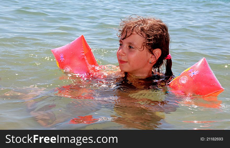 A small girl on the sea