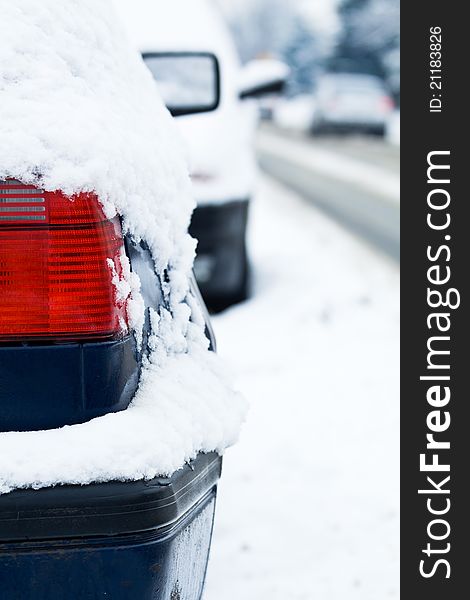 Car covered in snow on street