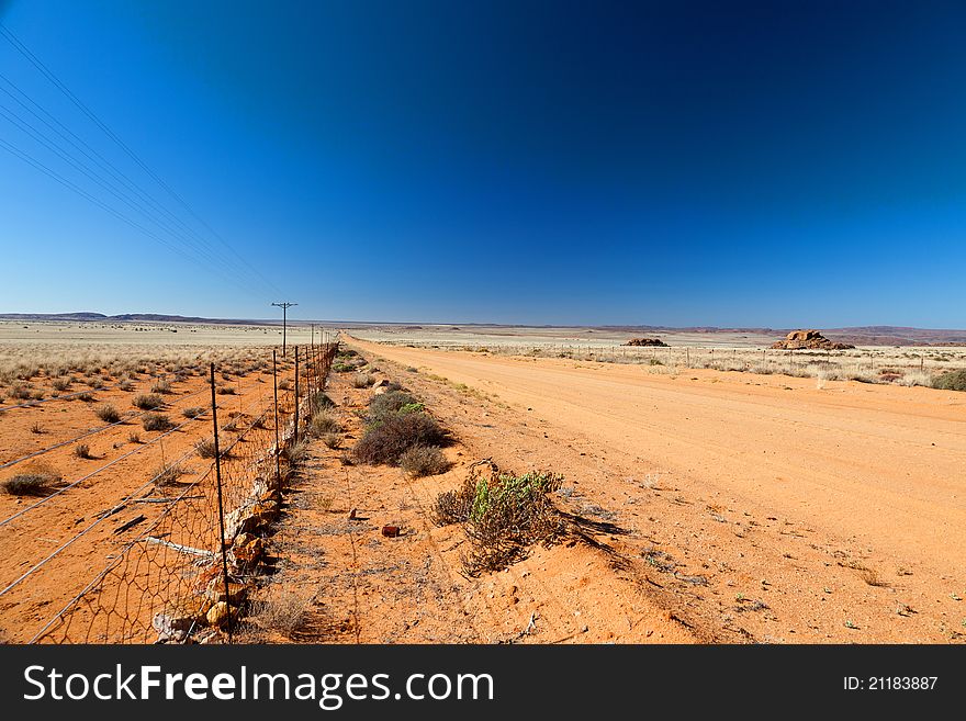 Road Through A Vast, Arid Landscape