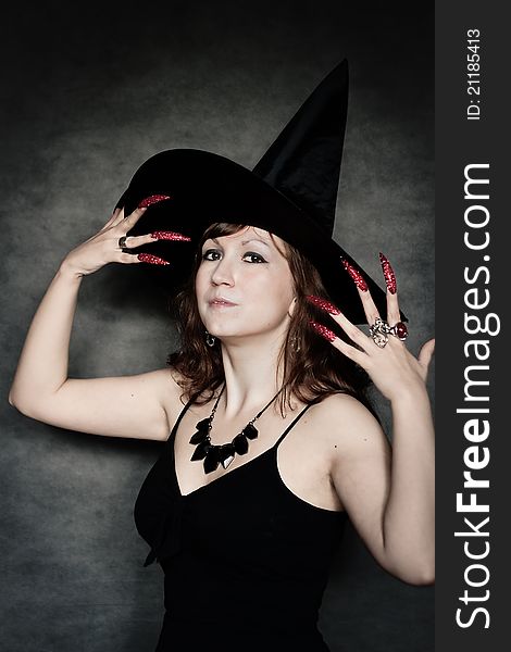 Witch with long red nails