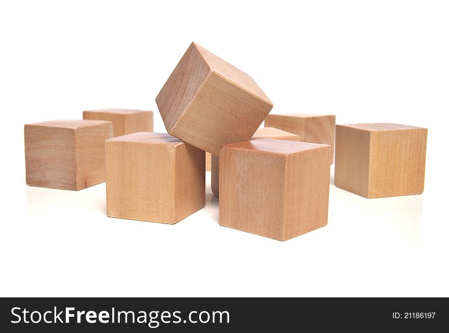 Natural colored wooden dices on white background