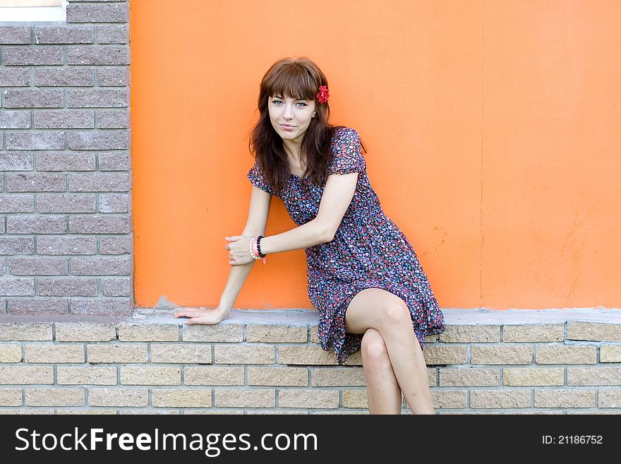 Girl posing outdoor near wall