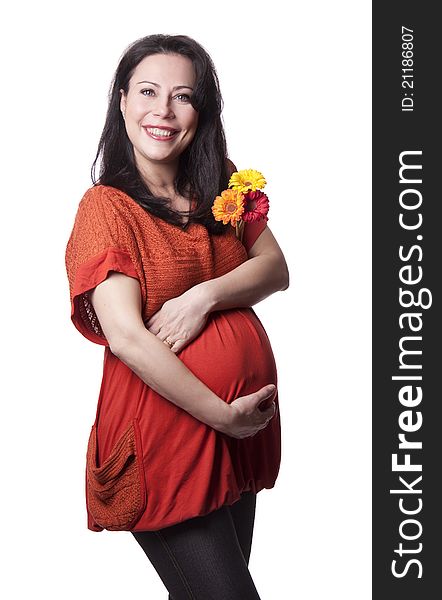 Adult pregnant woman with flowers isolated on white. A happy pregnancy