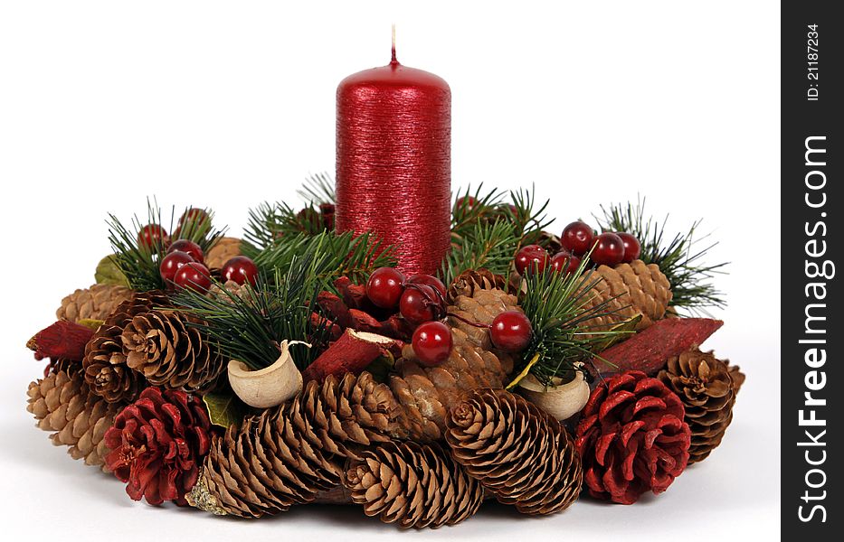 Red candle with the twigs of the spruce and cones. Red candle with the twigs of the spruce and cones