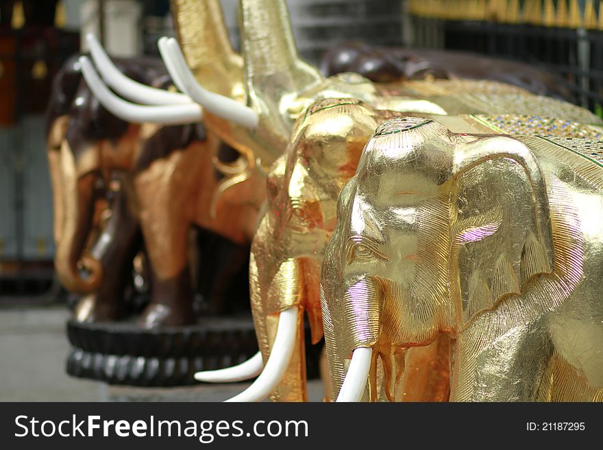 Wooden gilded elephants at Erawan shrine, Bangkok, Thailand. Wooden gilded elephants at Erawan shrine, Bangkok, Thailand