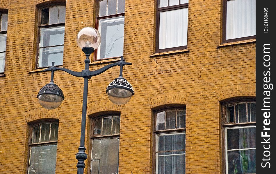 Street lantern in St.Petersburg infront of the brick tiled building
