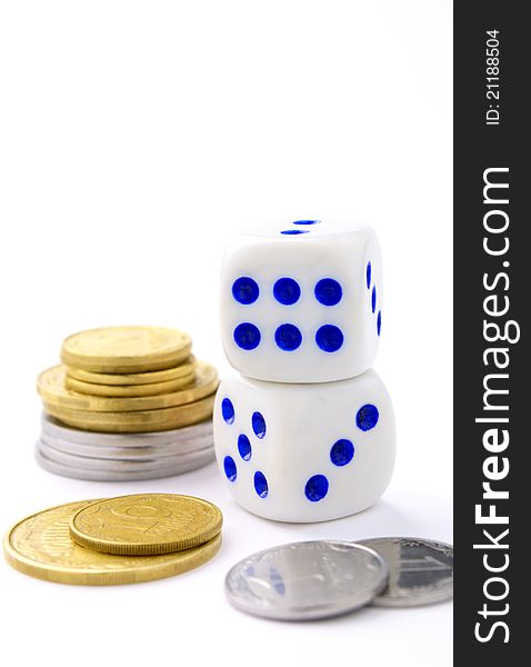 Dice and coins on a white background. Dice and coins on a white background