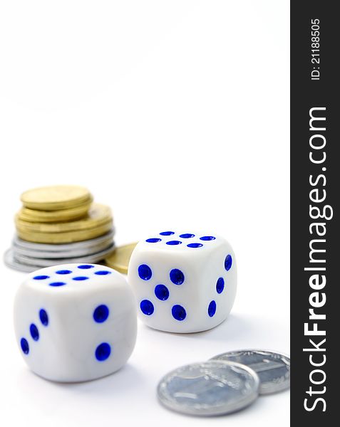 Dice and coins on a white background. Dice and coins on a white background