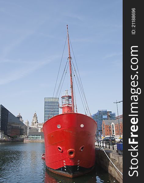 The Bows and Light of a Red Lightship in a English Dock