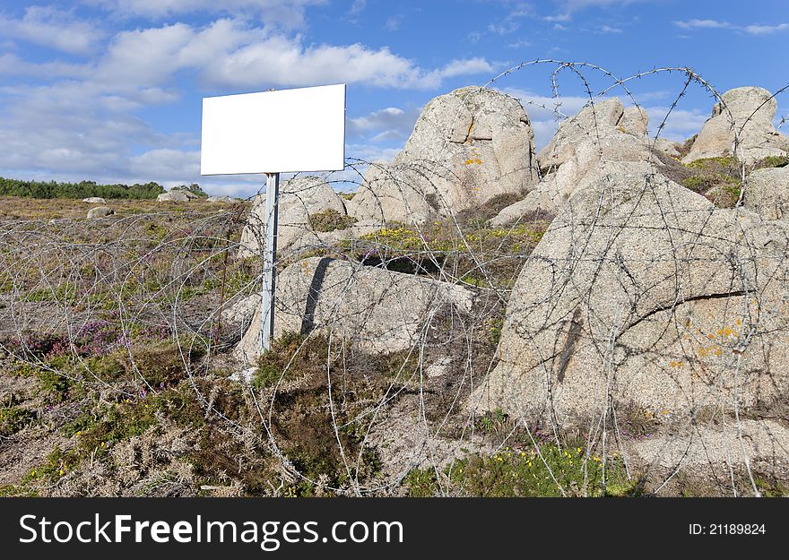 Barrier to nature with barbed wire