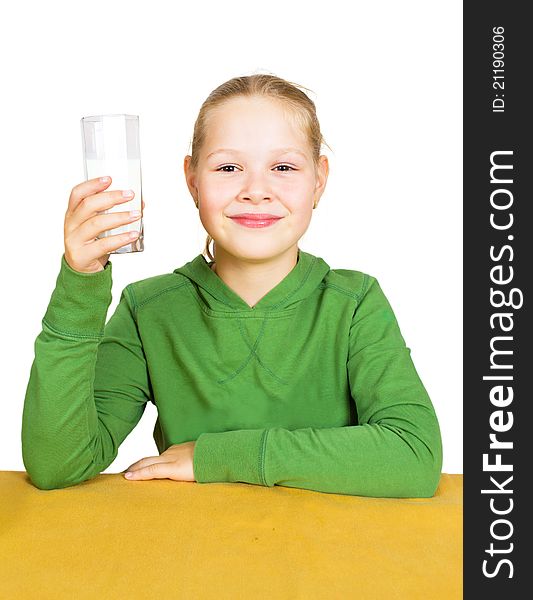 Happy little girl with a glass of milk, isolated over white