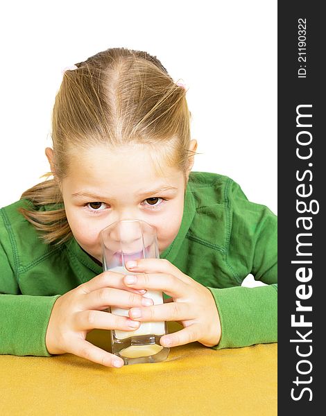 Happy little girl with a glass of milk, isolated over white