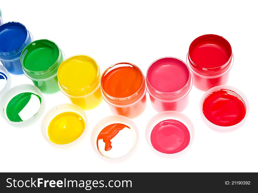 Multi-colored gouache paint isolated on a white background