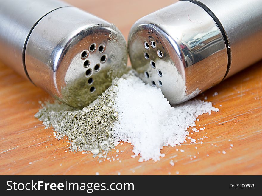 Salt and pepper sprinkled on the table