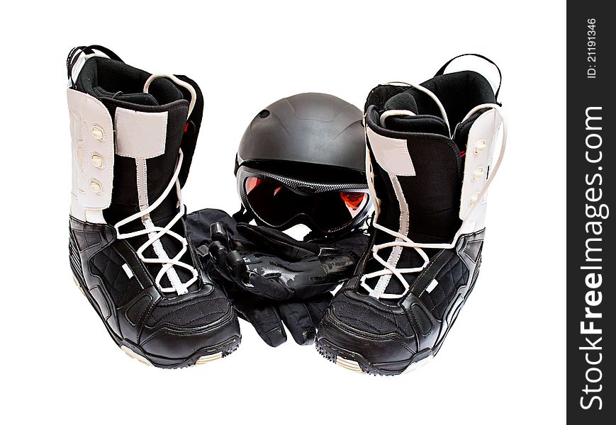 Snowboard boots, helmet, gloves, glasses on a white background.