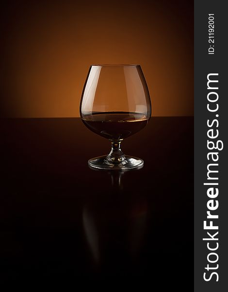 Glass of cognac with copy space