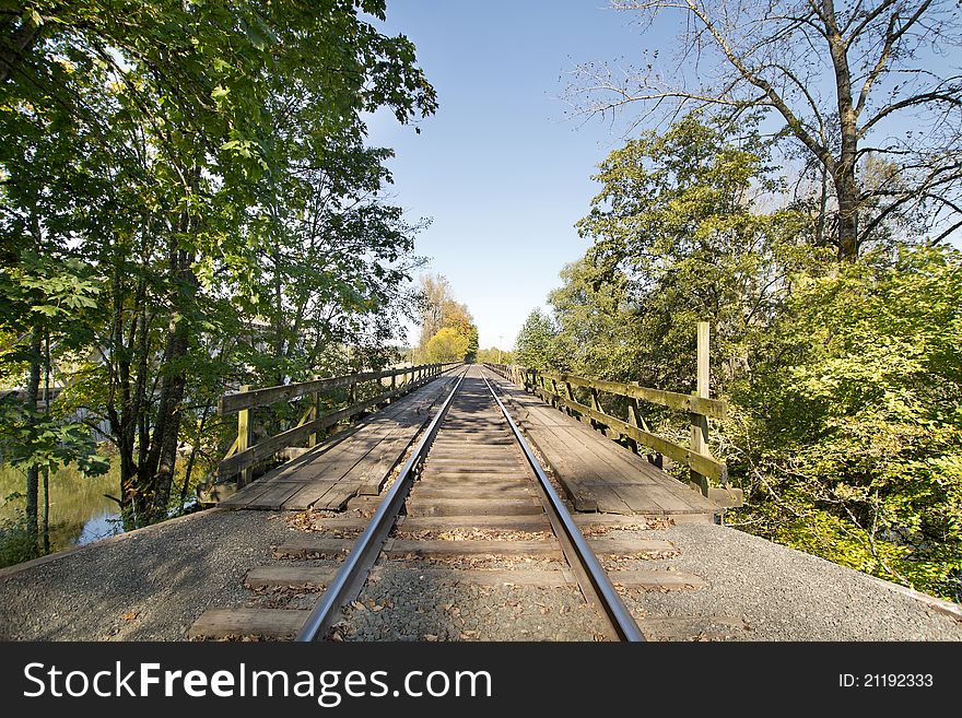 Train Track on Wooden Bridge over River in Oregon
