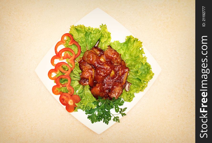 Fried meet with fresh pepper on the plate