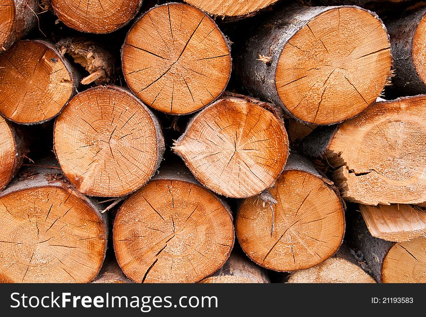 Closeup shot of pile of wooden logs for pattern or background subjects.