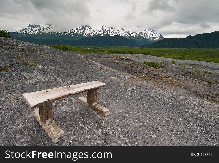 Wooden bench on mountain overlooking majestic landscape. Wooden bench on mountain overlooking majestic landscape.