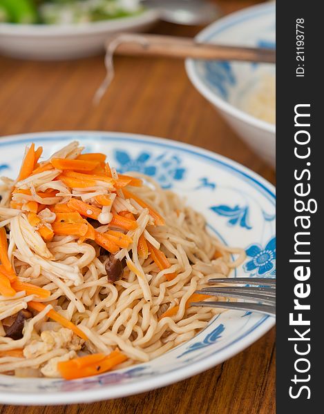 Closeup shot of Asian vegetarian noodles on dining table. Closeup shot of Asian vegetarian noodles on dining table.