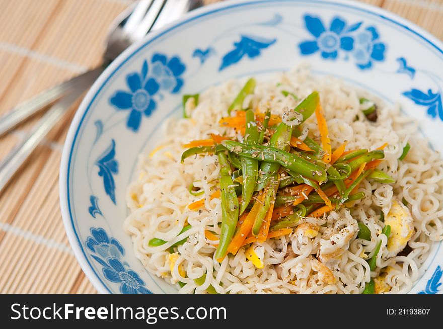 Oriental style mixed vegetable noodles topped with fragrant spices. Oriental style mixed vegetable noodles topped with fragrant spices.