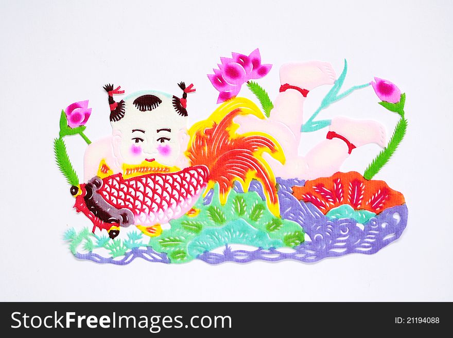 Paper-cutting is a traditional Chinese folk art. Paper-cut of a boy carrying fish represents good luck and happiness.