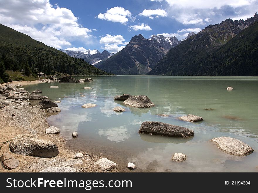 Xinluhai Holy Lake (altitude 4,040m) which means â€œthe enamored lakeâ€ in Tibetan is the biggest of its kind in Sichuan,China surrounded by five snow capped mountains.