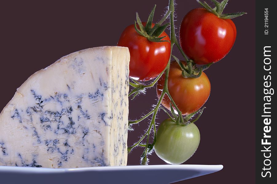 Slice of full fat soft blue cheese. Slice of full fat soft blue cheese